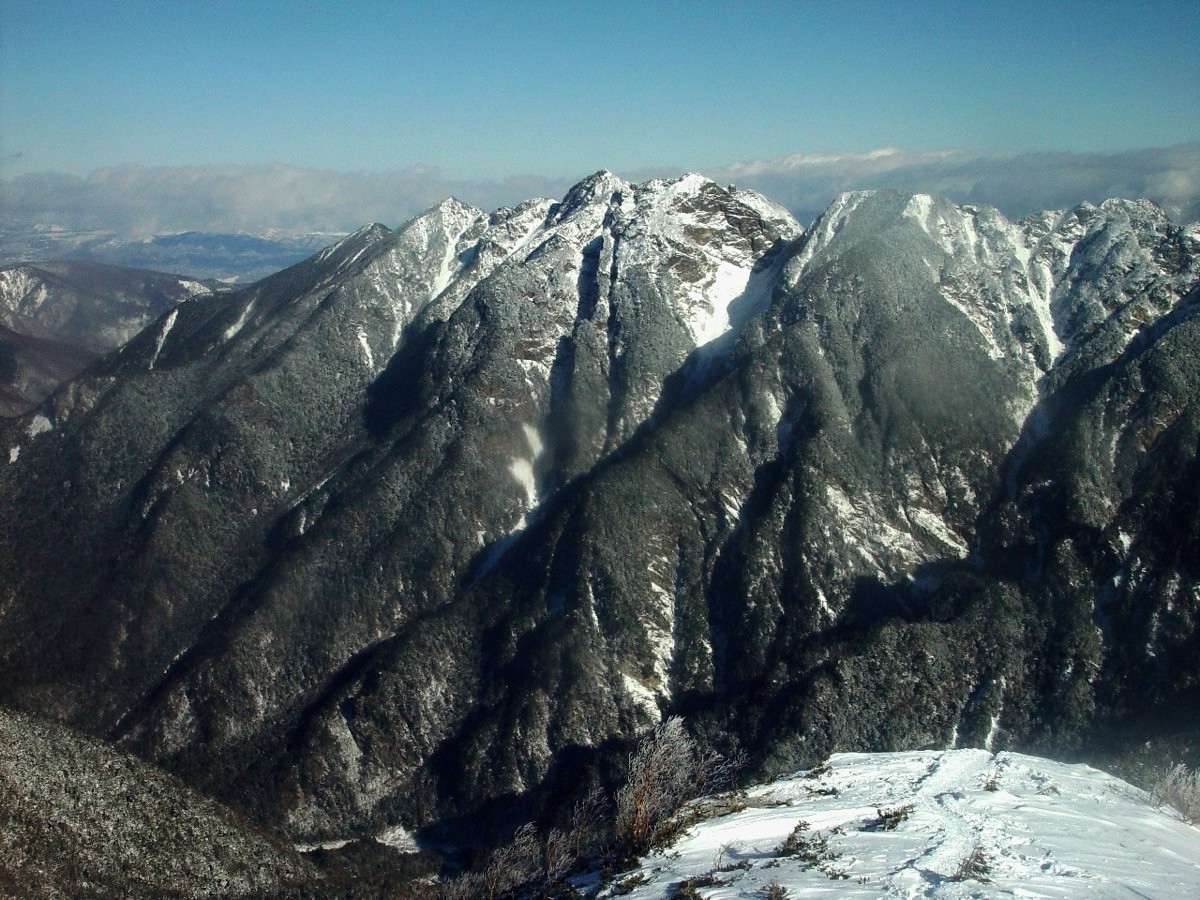 The saw-tooth rock ridge of Mt. Nokogiri in winter, seen from Mt. Kosenjo
